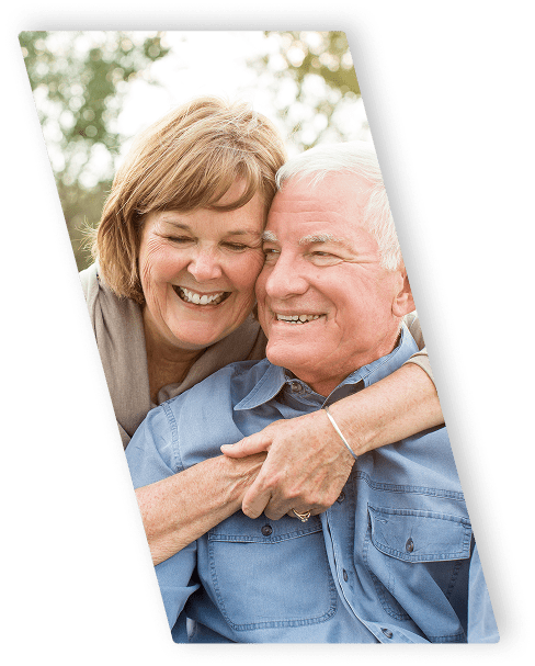 elderly couple embracing